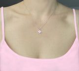 A beautiful design featuring a graceful four-leaf clover handcrafted in Sterling Silver and plated in 14 K Gold, the Lucky Clover and Sparkles Necklace showcases tiny cubic zirconia stones ( pink or white). Recognized as the universal symbol of good luck, this clover pendant necklace can be a wonderful gift for any occasion. Options:      Sterling Silver with14 K White Gold Plating and Pink Zirconia Stones Sterling Silver with 14 K Yellow Gold Plating and White Zirconia Stones