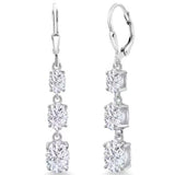 The Astrid Earrings feature 1.2 Carat Moissanite diamonds for each earring, boasting extraordinary beauty. They are crafted in Certified Sterling Silver and plated in 18K White Gold each earring featuring three brilliant Moissanite stones. Exuding sophistication, they are perfect for special occasions and make a great option as Bridal earrings.  Lever backs provide security and comfort all day long.