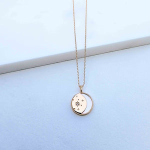  The Moon and Stars Necklace is masterfully crafted in Sterling Silver and plated in Champagne Gold. The pendant featured shell for the outline of the moon representation and cubic zirconia stones to symbolize the stars. What a beautiful piece of jewelry to show appreciation to a love one or celebrate yourself. 